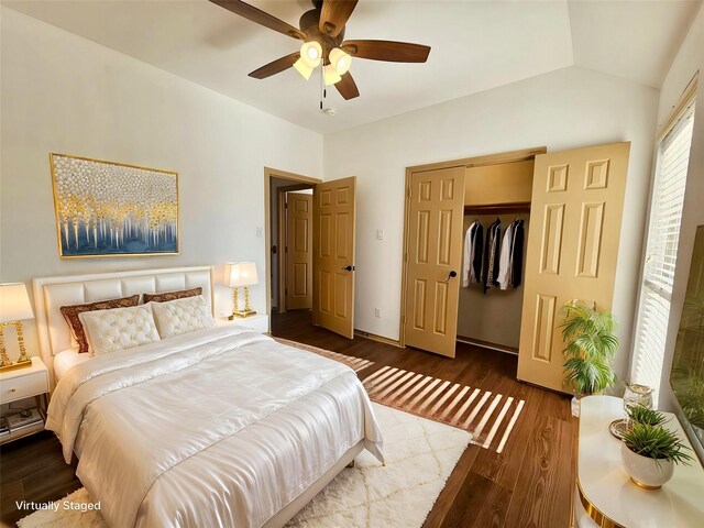 bathroom featuring hardwood / wood-style flooring, vanity, toilet, and a tub