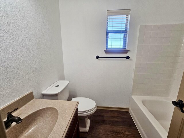 washroom featuring cabinets, washer hookup, dark hardwood / wood-style floors, and electric dryer hookup