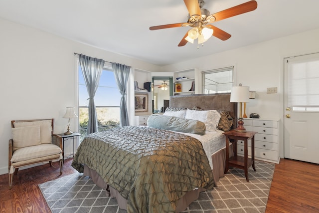 bedroom with dark wood-type flooring and ceiling fan