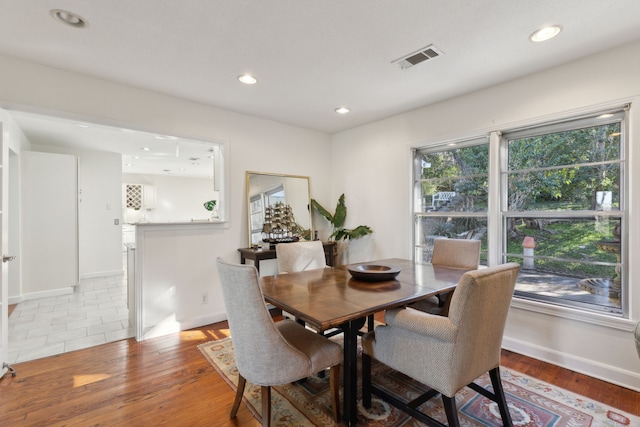 dining area with light hardwood / wood-style flooring