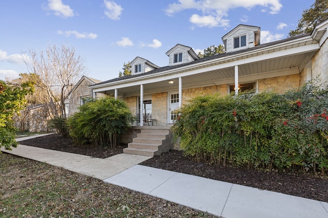 cape cod home with a porch