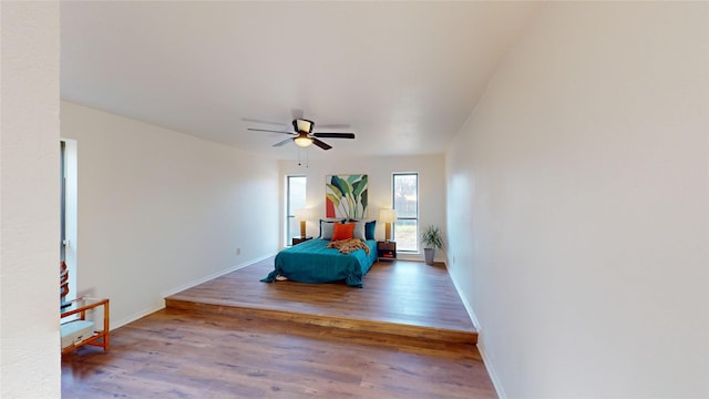 bedroom featuring wood-type flooring and ceiling fan