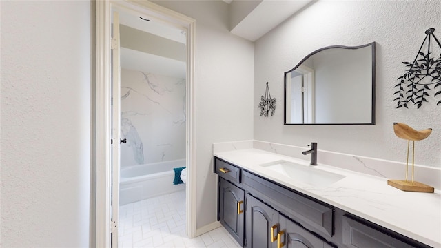 bathroom featuring tile patterned floors, vanity, and tub / shower combination