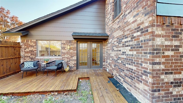 wooden deck featuring french doors