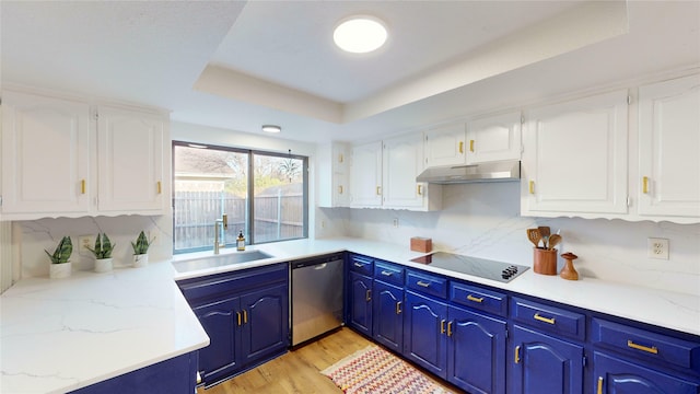 kitchen with sink, black electric cooktop, a tray ceiling, dishwasher, and white cabinets