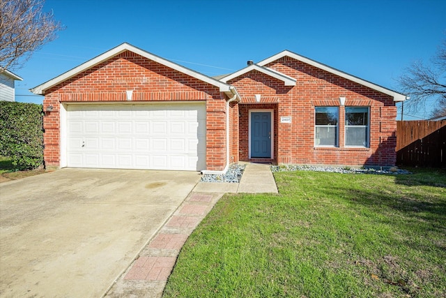 ranch-style home with a garage and a front lawn