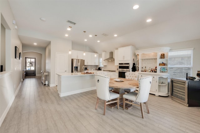 dining space with light hardwood / wood-style flooring