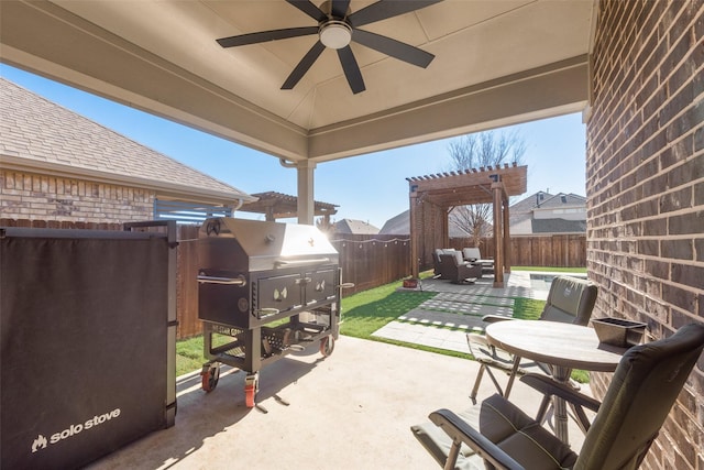 view of patio / terrace featuring a ceiling fan, outdoor dining area, a fenced backyard, and a pergola