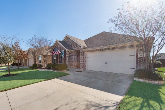 view of front of home featuring brick siding, roof with shingles, concrete driveway, an attached garage, and a front lawn