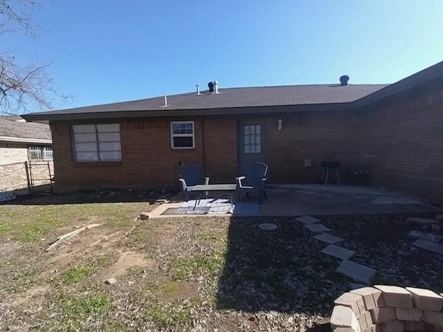 back of property featuring a patio area