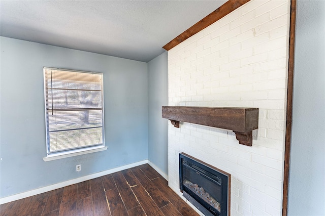 unfurnished living room featuring dark hardwood / wood-style floors