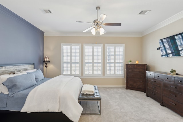 bedroom with multiple windows, crown molding, light colored carpet, and ceiling fan