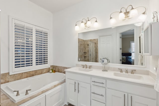 bathroom with vanity and independent shower and bath