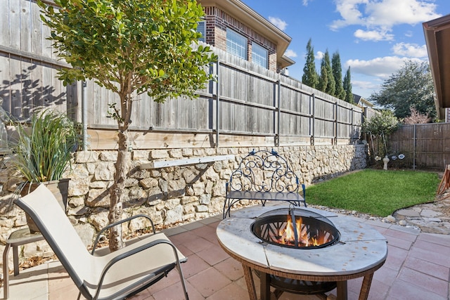 view of patio / terrace with an outdoor fire pit