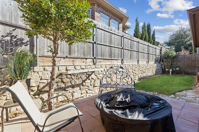 view of patio with a grill