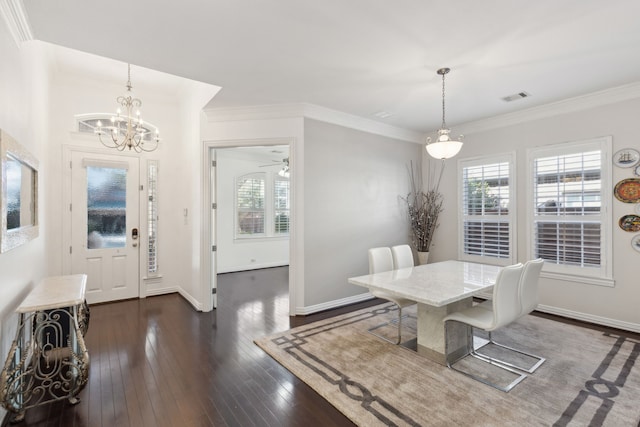 dining room with crown molding, dark hardwood / wood-style floors, and a wealth of natural light