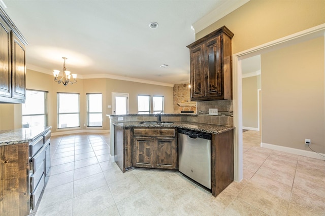 kitchen with dishwasher, sink, dark stone countertops, a chandelier, and dark brown cabinetry