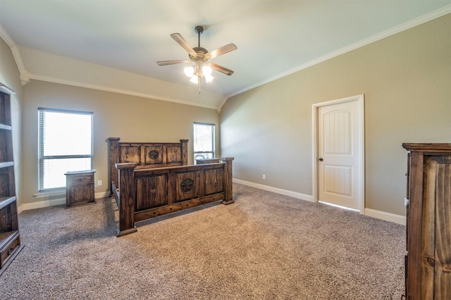 carpeted bedroom with crown molding, ceiling fan, and vaulted ceiling