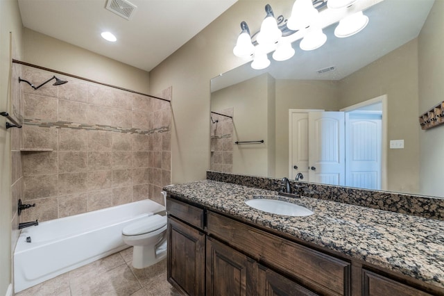 full bathroom with vanity, toilet, tile patterned floors, and tiled shower / bath