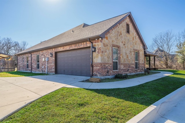 view of side of property featuring a garage and a yard