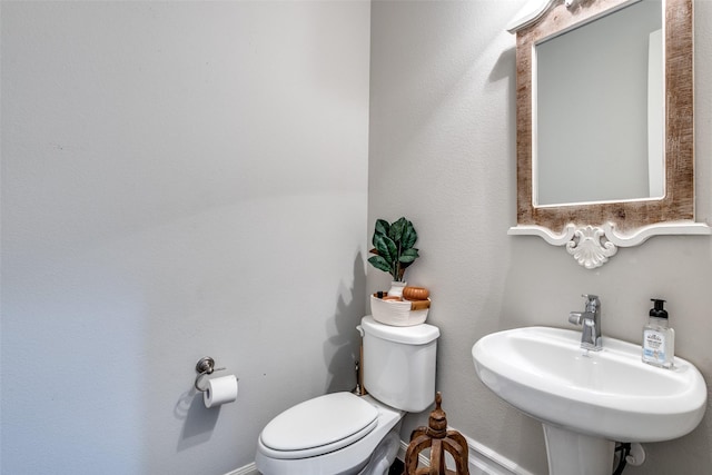 bathroom with sink and toilet