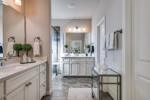 bathroom with vanity and a shower