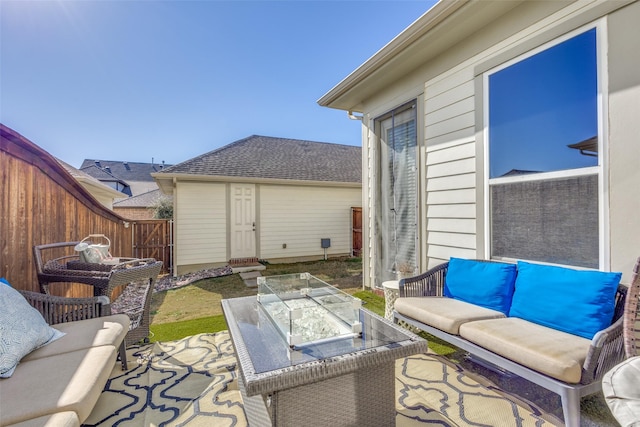 view of patio with outdoor lounge area and an outbuilding