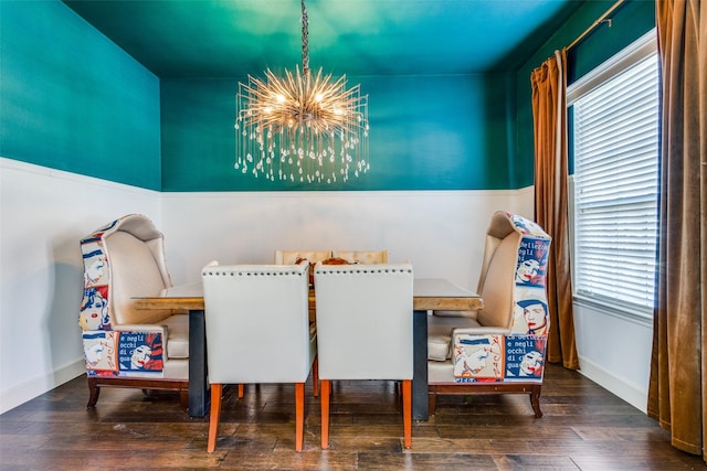 dining room featuring an inviting chandelier, dark wood-type flooring, and plenty of natural light