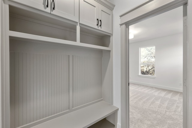 mudroom featuring carpet flooring