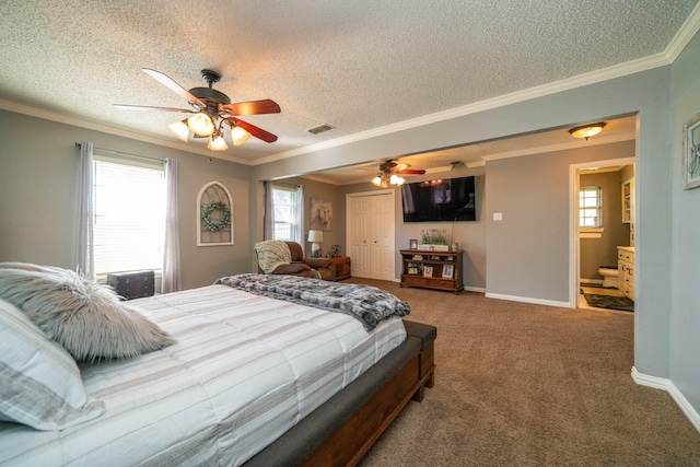 bedroom featuring multiple windows, ornamental molding, carpet flooring, and ceiling fan