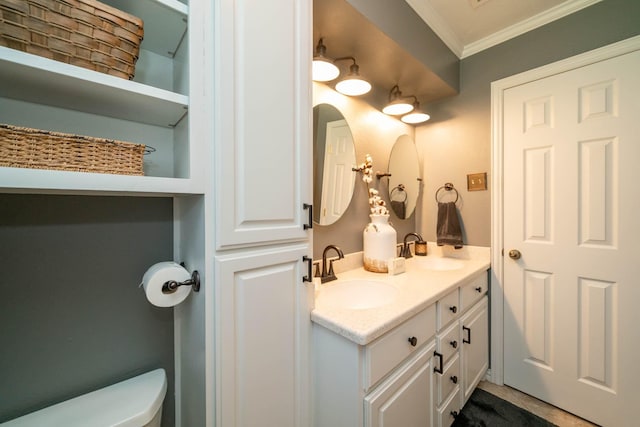 bathroom with crown molding, tile patterned floors, vanity, and toilet