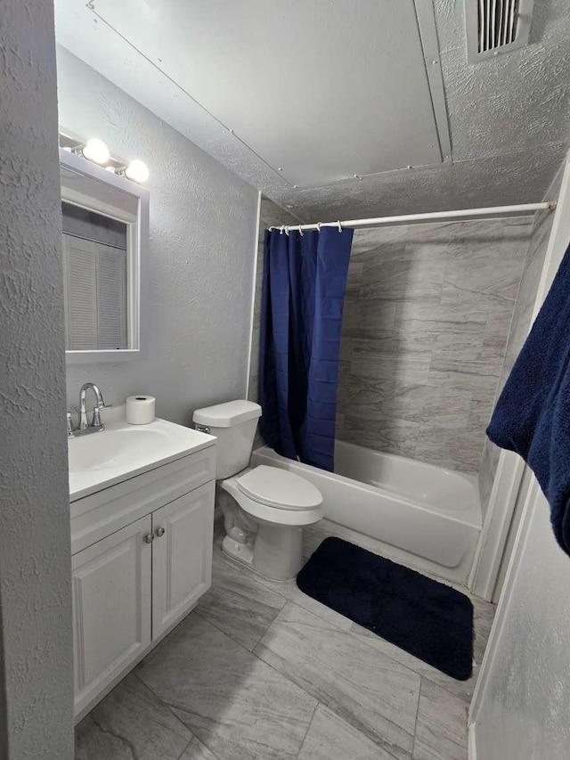 full bathroom with vanity, toilet, and shower / tub combo