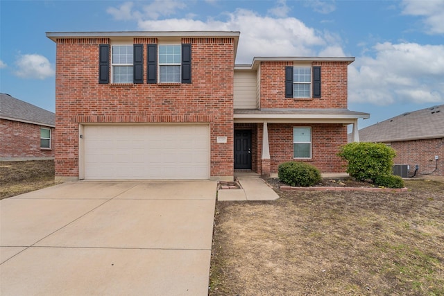 front of property with a garage and central AC