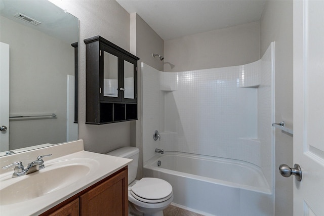 full bathroom featuring washtub / shower combination, vanity, and toilet