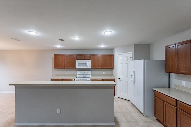 kitchen with white appliances and a kitchen island