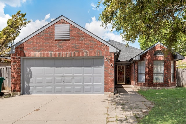 front facade featuring a garage and a front yard