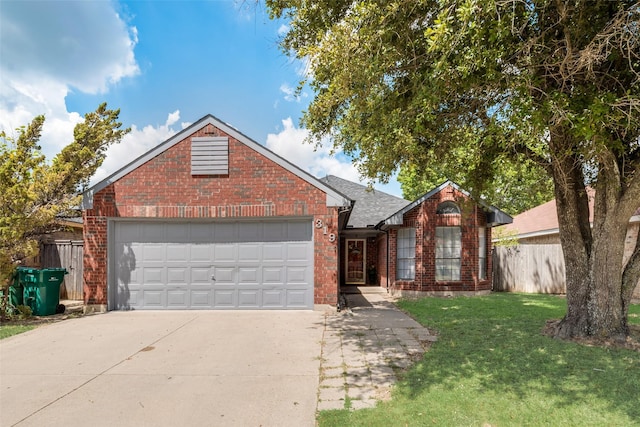 view of front facade with a garage and a front yard