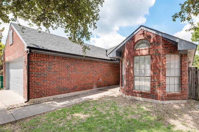 view of side of property featuring a garage