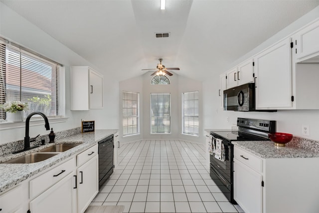 kitchen featuring white cabinetry, light stone countertops, sink, and black appliances