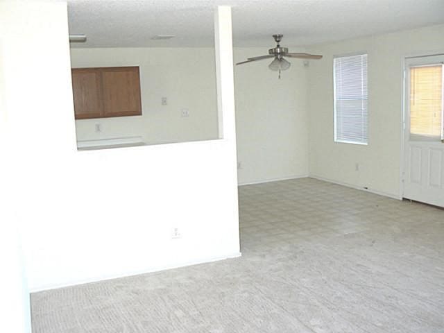 spare room with ceiling fan