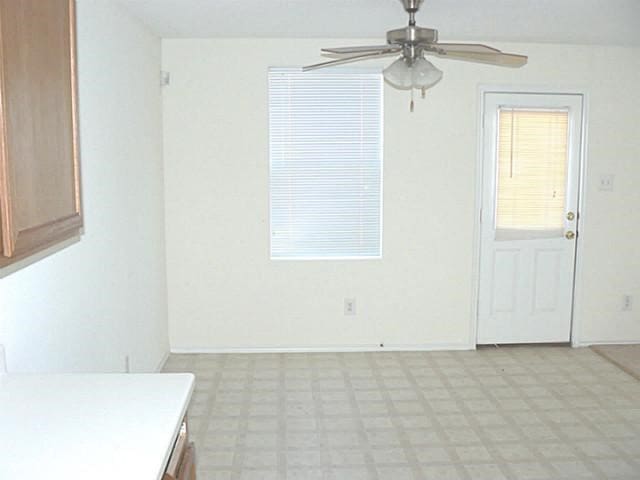 spare room with ceiling fan