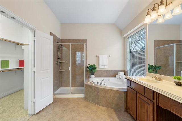 bathroom with lofted ceiling, vanity, plus walk in shower, and tile patterned floors