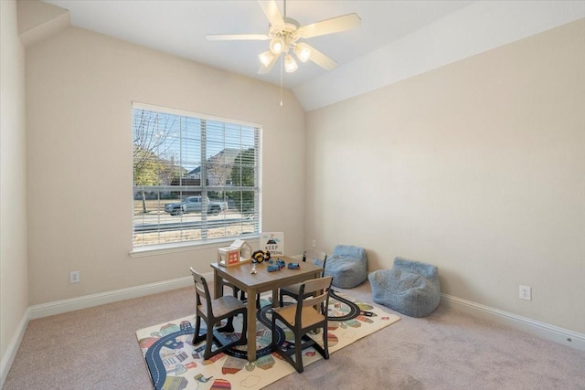 dining area featuring light carpet, a wealth of natural light, lofted ceiling, and ceiling fan