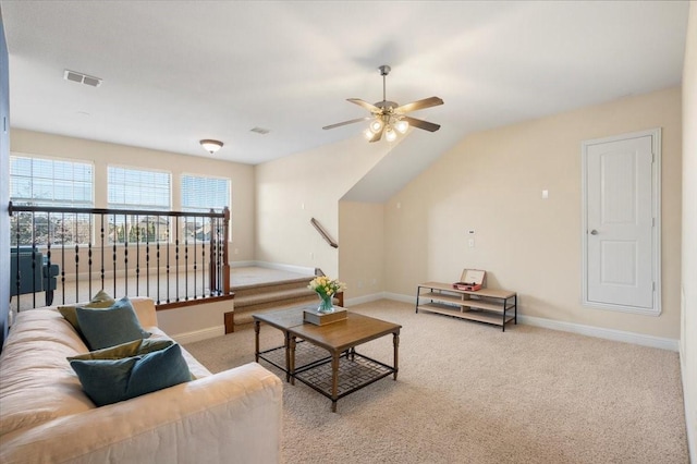 living room featuring light carpet, lofted ceiling, and ceiling fan