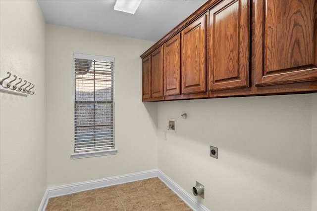 clothes washing area featuring washer hookup, gas dryer hookup, cabinets, and hookup for an electric dryer