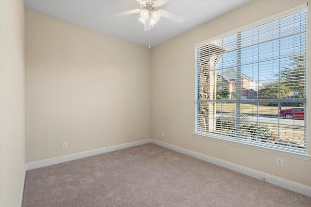 carpeted empty room with ceiling fan