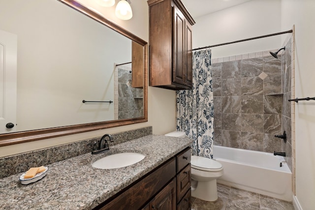 full bathroom featuring vanity, shower / tub combo with curtain, and toilet