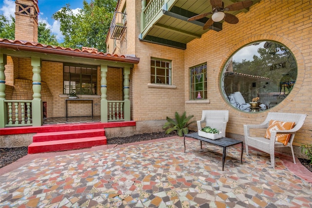 view of patio featuring ceiling fan