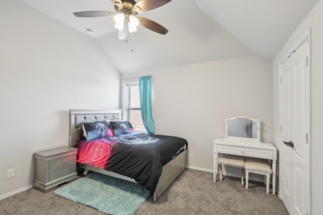 carpeted bedroom featuring vaulted ceiling, a ceiling fan, and baseboards