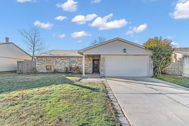 ranch-style home with a garage and a front yard